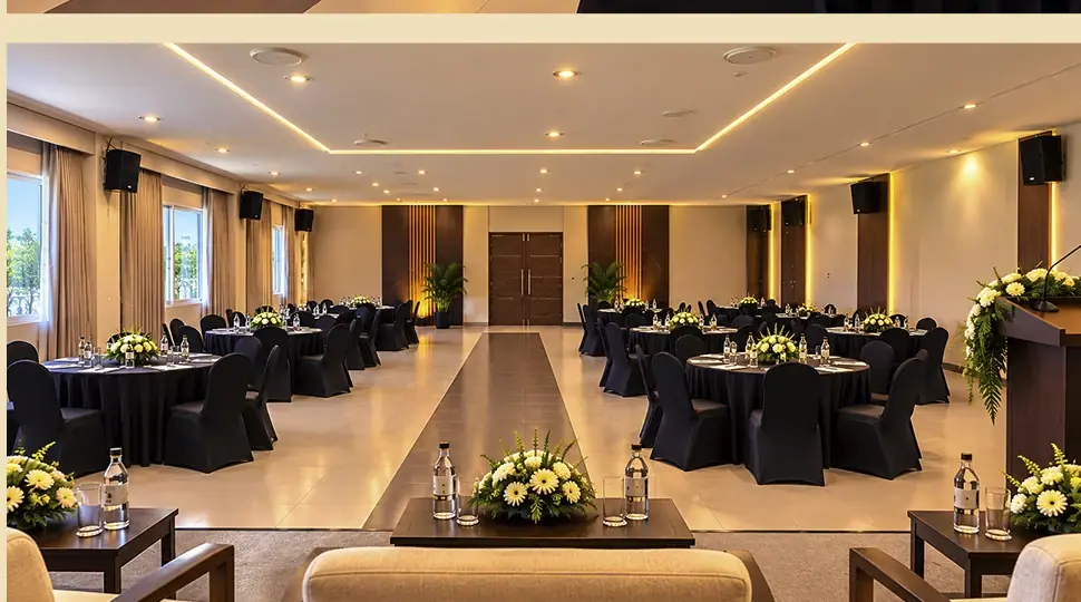 Elegantly arranged banquet dining tables at Milan Hall Honnavar