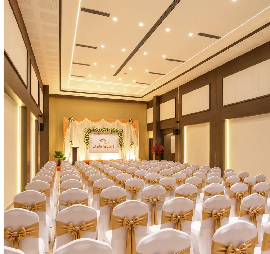 Sidhvin Banquet Hall auditorium setup for weddings and conferences at Hotel Pumerai Honnavar