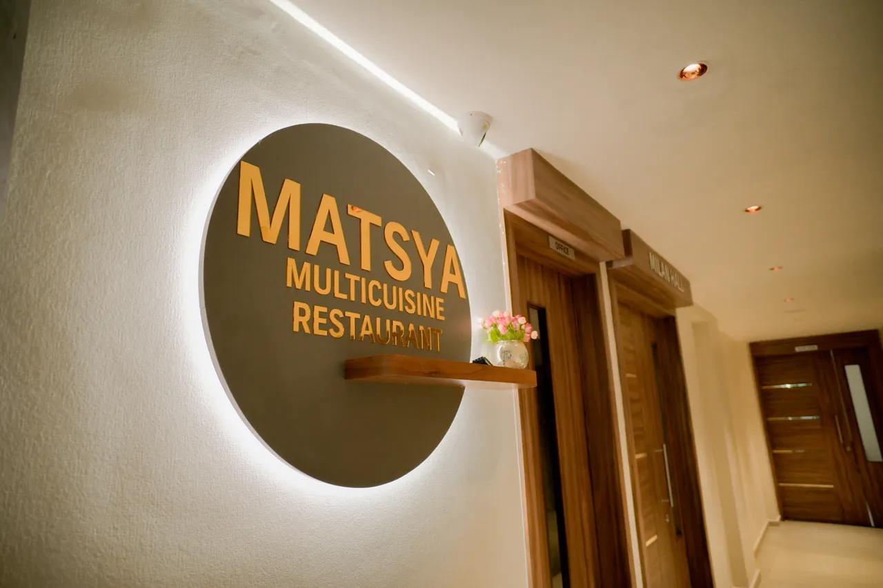 Matsya Multicuisine Restaurant dining room at Hotel Pumerai Honnavar