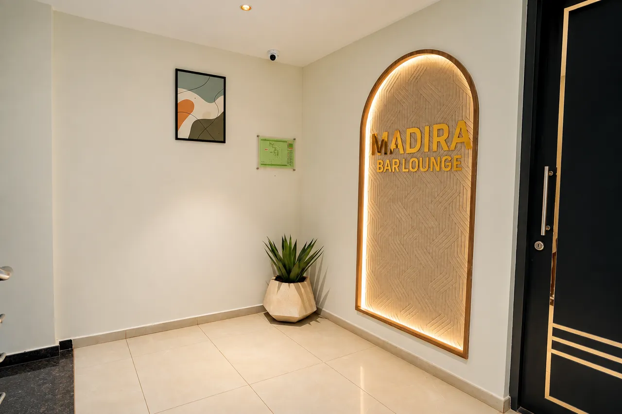Illuminated architectural archway at Hotel Pumerai Honnavar