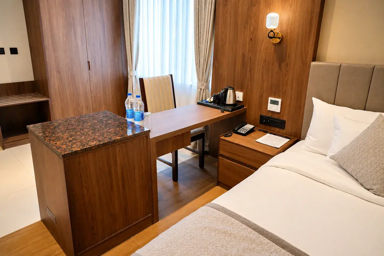 Club Room with Balcony interior photo 4 at Hotel Pumerai Honnavar