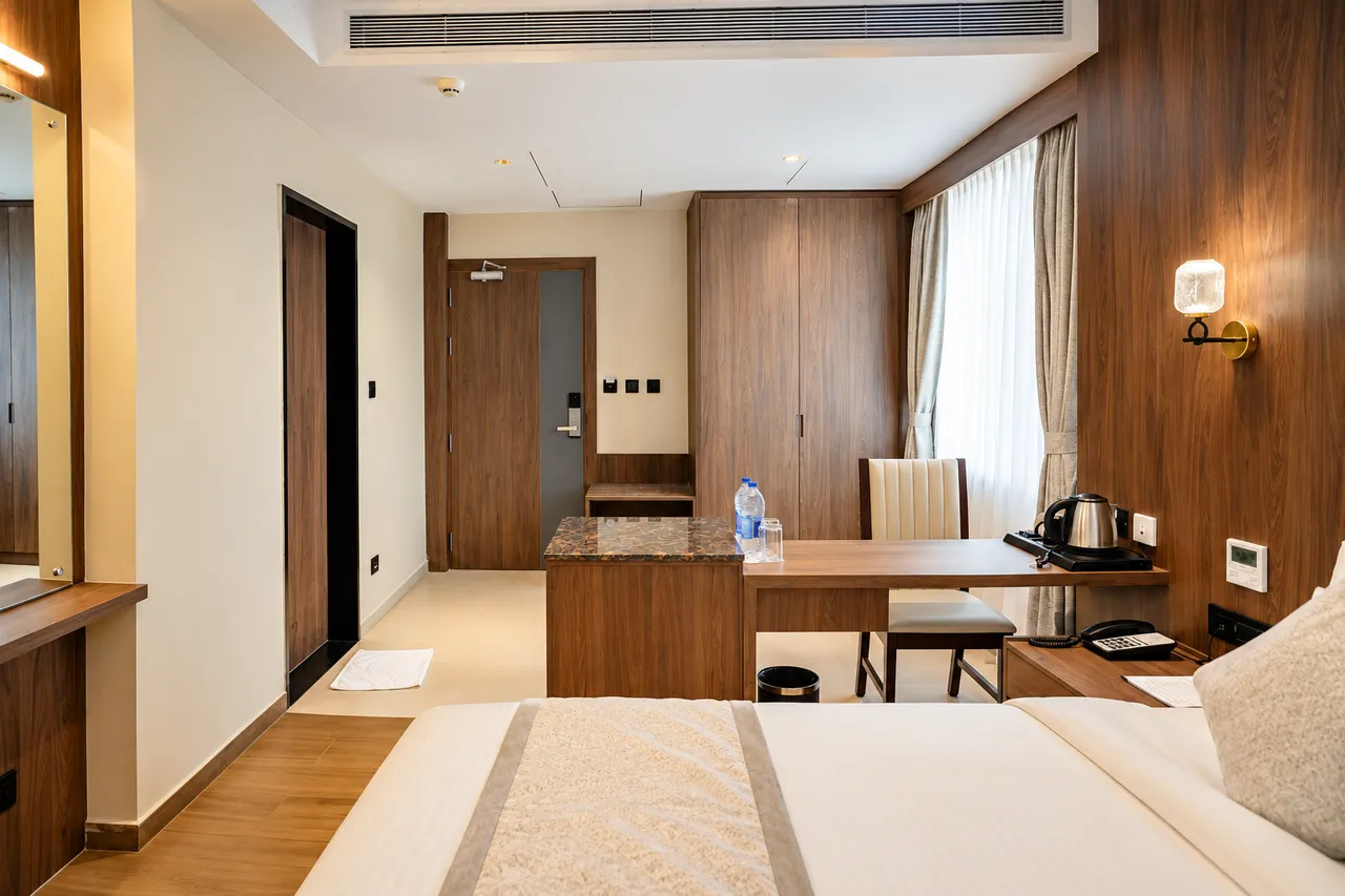 Deluxe Room interior photo 2 at Hotel Pumerai Honnavar